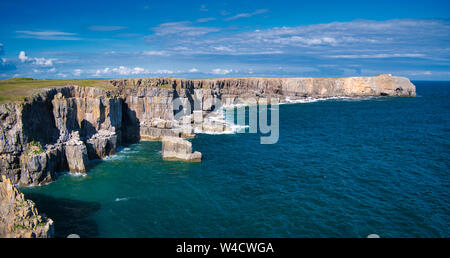 Stratified coastal cliffs at St Govan`s Head in Pembrokeshire, South Wales, UK, as viewed from the Coast Path, on a sunny day in summer. Stock Photo